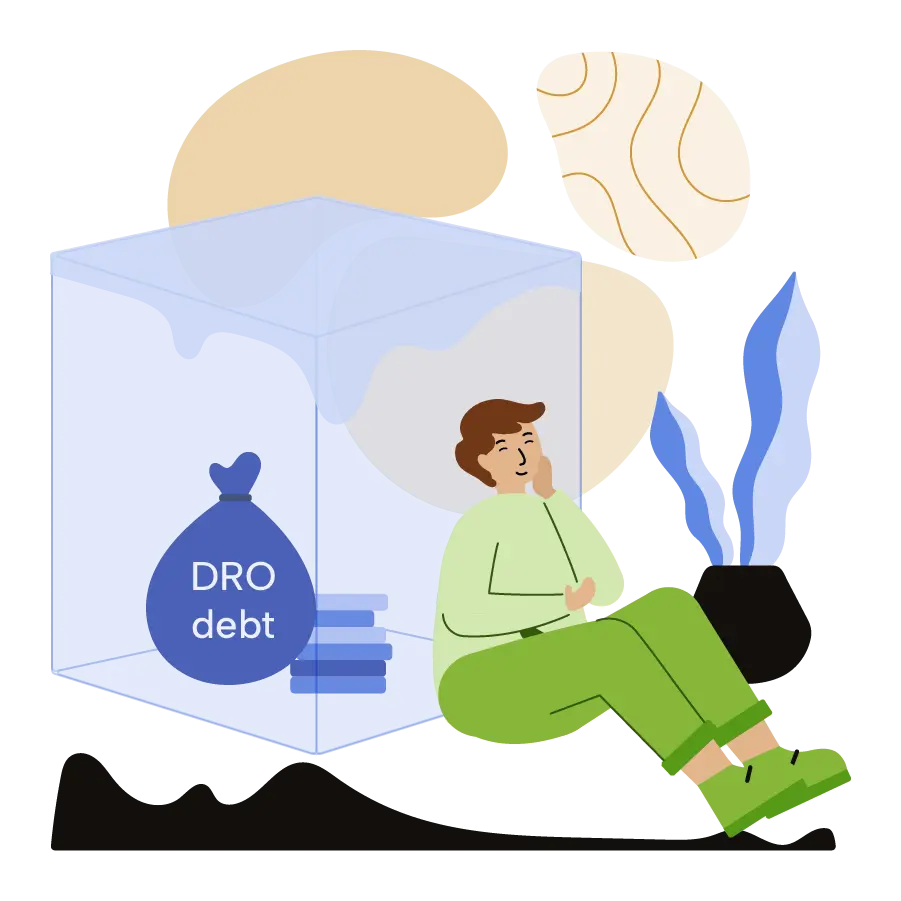 A man sitting next to a DRO bag within an ice block.